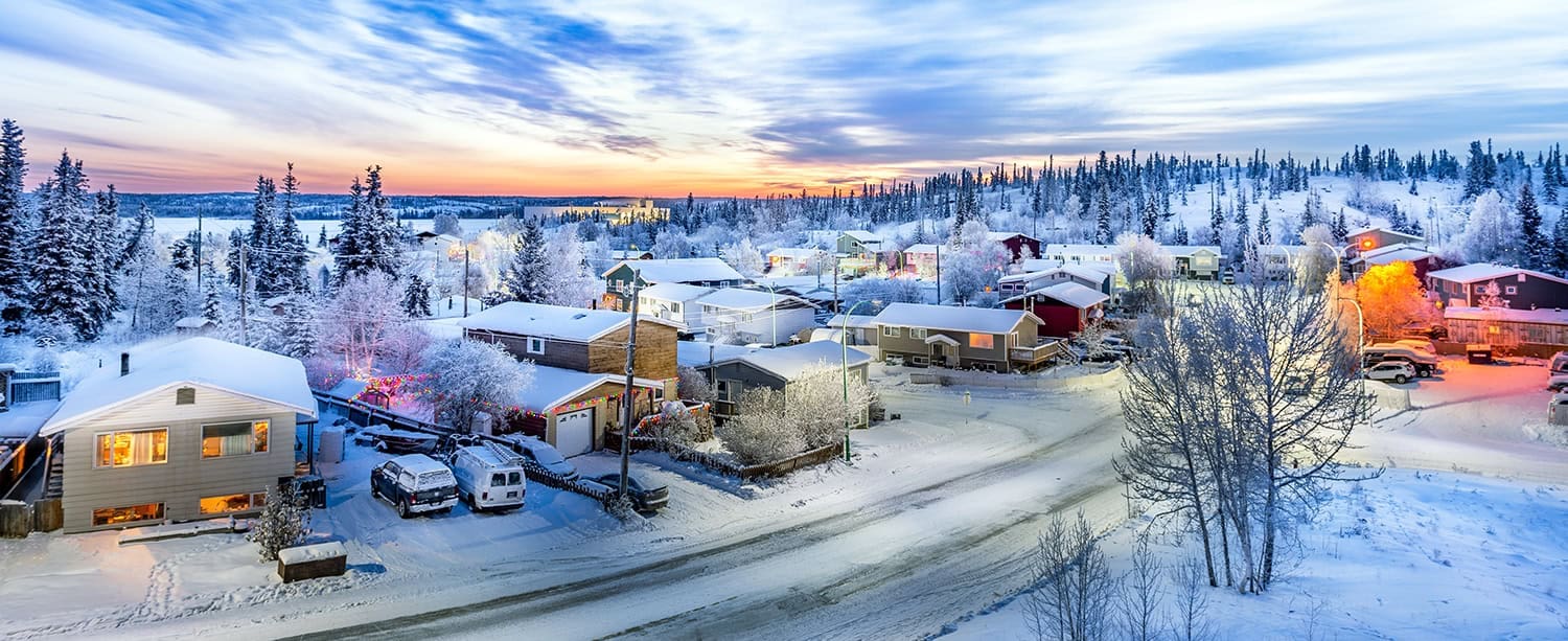 sunrise over looking neighborhood in yellowknife during winter w